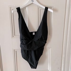 Low cut black one piece